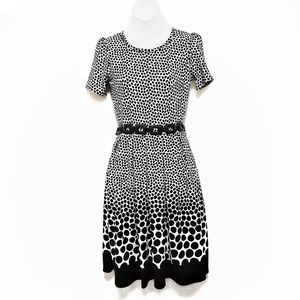 Graduated black polka dot pocket dress